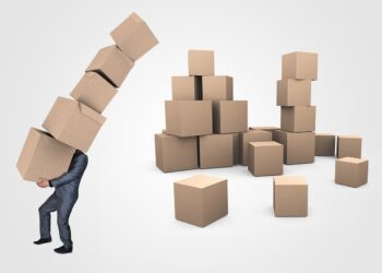 Mann mit vielen Kartons, Symbolbild für Arbeit