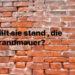 Mauer mit Aufschrift: "Hält sie stand, die Brandmauer?