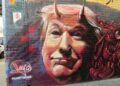 Donald Trump mit Hörnern und gespaltener Zunge. Graffiti in Melbourne, Australien
