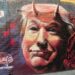 Donald Trump mit Hörnern und gespaltener Zunge. Graffiti in Melbourne, Australien