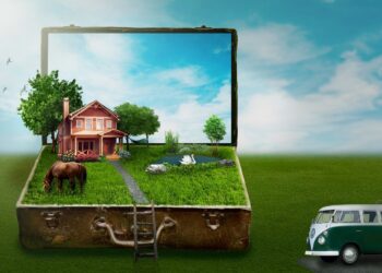 Phantasiebild, Koffern mit Eigenheim und schönen Garten, VW-Bulli parkt vor dem Koffer