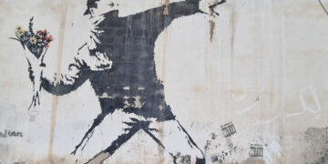 Banksy Graffiti an der Mauer zur Westbanj