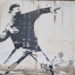 Banksy Graffiti an der Mauer zur Westbanj