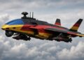 Futuristsiches Kampfflugzeug in den FArben der Ukraine und der Bundesrepublik. KI generiert mit GROK